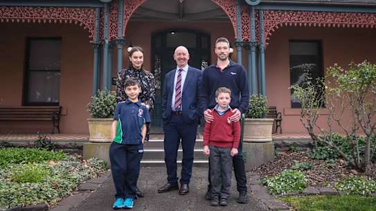 Bill Sweeney (centre) principal of Hume Grammar with school families L-R Faten and Aydin Eren and Simon and Hamish Peryman.