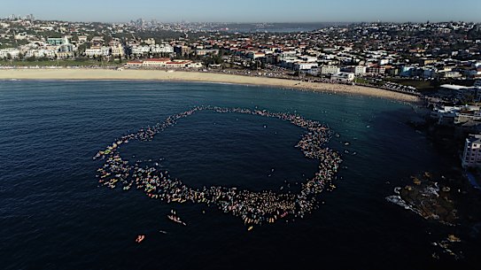 A circle was formed in the ocean to pay respect to those killed and injured on Sunday.