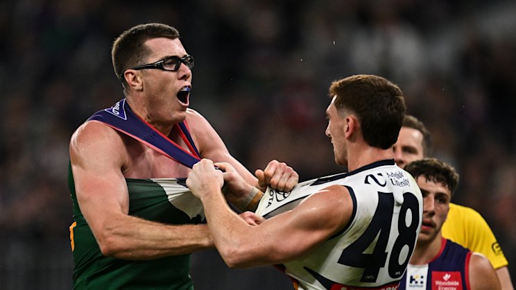 Fremantle players celebrate a clutch goal