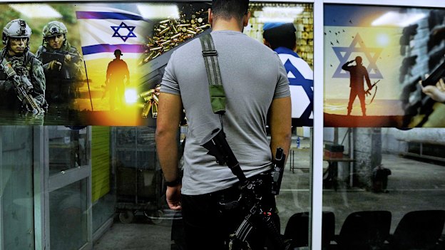 Almog Meirov attends a shooting range on the outskirts of Tel Aviv. The Israeli government has relaxed gun laws to allow citizens to carry a weapon if they have done military service and passed a medical and practical tests.