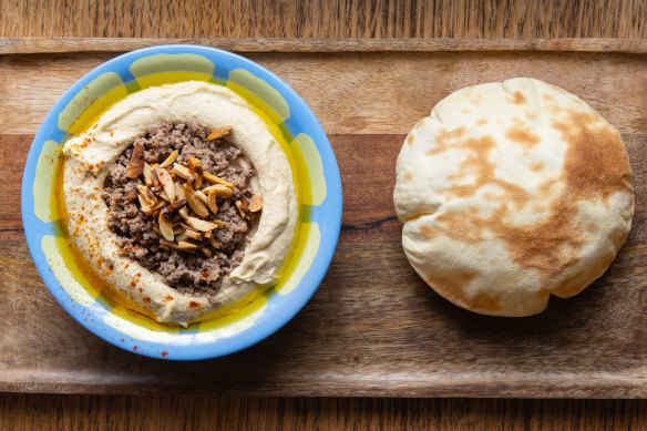 Smooth creamy hummus topped with  confit lamb.