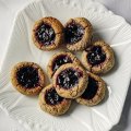 Flourless hazelnut cookies with wattleseed and cherry.