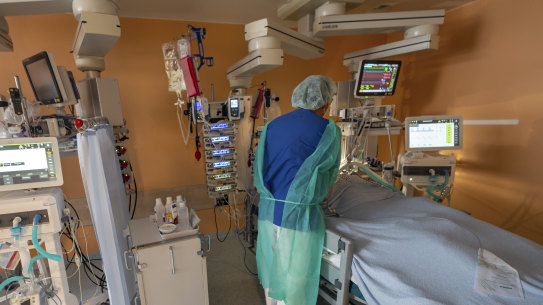 Head physician Lorenz Nowak treats a coronavirus patient in the ICU of the Asklepios Clinic in Munich, Germany, on Thursday.