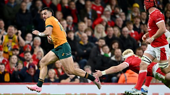 Tom Wright races away for a try in the first half.