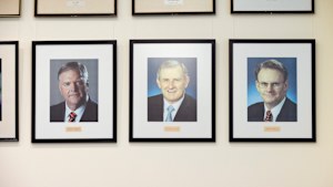Mark Latham’s portrait, bottom right, will remain in Labor’s caucus room with text added below.
