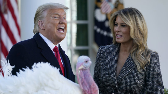 US President Donald Trump pardons a Thanksgiving turkey, Corn, during a ceremony with first lady Melania Trump on Tuesday.