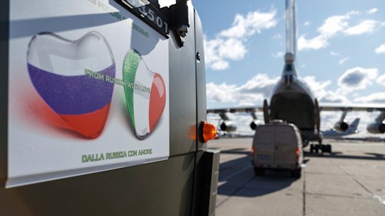 Photo supplied by Russian Defense Ministry Press Service, military trucks load onto an Il-76 cargo plane in Chkalovsky military airport outside Moscow, Russia. 