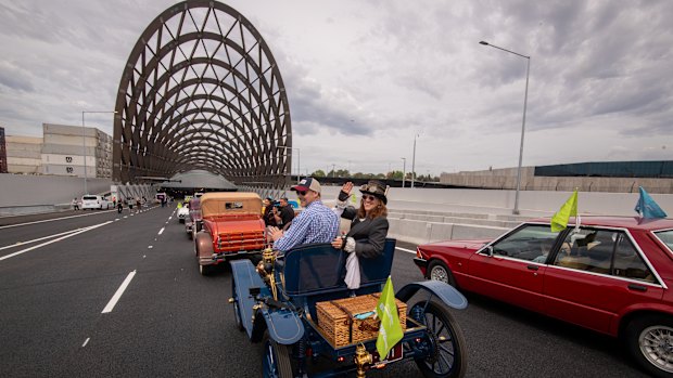Louise Karch (right) in her vintage car about to drive through the tunnel.
