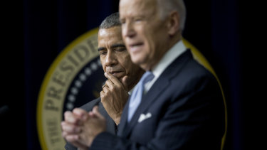 Then US President Barack Obama listens as Vice-President Joe Biden speaks in December 2016.