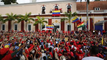 Venezuela's President Nicolas Maduro speaks to his supporters from a balcony at Miraflores presidential palace during a rally in Caracas on Wednesday.