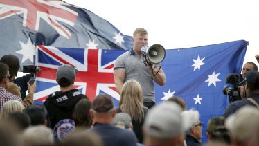 Convicted criminal and right-wing extremist Blair Cottrell addresses the rally.