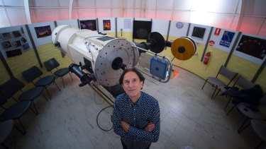 Perry Vlahos with the 18-inch optical telescope.