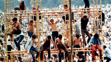 Festival goers on the sound tower scaffolding at Woodstock. 