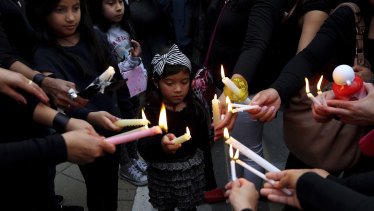 Mourners hold a vigil on Friday outside the presidential palace in Nicosia, Cyprus.