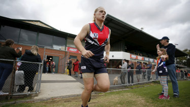 Hannah Mouncey takes the field for the Darebin Falcons in her debut VFLW match at Preston City Oval on Saturday. 