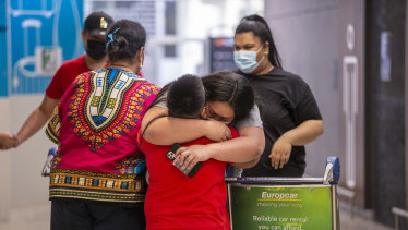 Families were reunited on Monday after being separated by flight bans into Melbourne Airport.