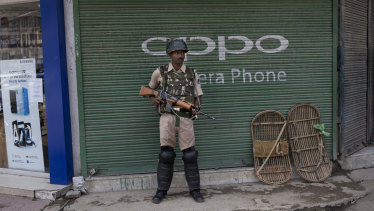 An Indian paramilitary soldier stands guard in Srinagar, Kashmir.