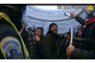 This image from Metropolitan Police Department body camera video was used to arrest Pauline Bauer, pointing second to left, taken in the Rotunda of the U.S. Capitol on January 6, 2021