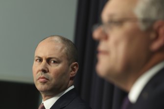 Treasurer Josh Frydenberg and Prime Minister Scott Morrison, considering human and economic impacts of the pandemic.