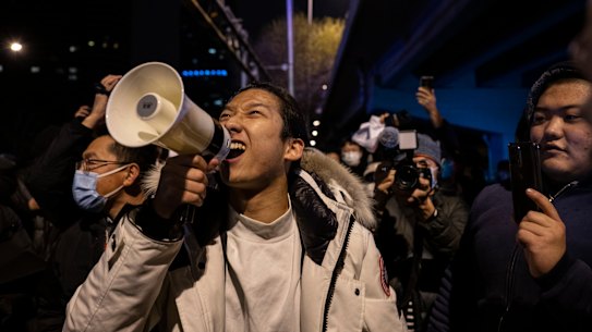 A protester in Beijing shouts slogans during a protest against China’s strict zero-COVID measures.