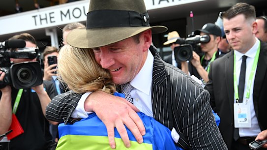 Jamie Kah is hugged by trainer Ciaron Maher.