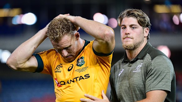 Fraser McReight (right) comforts Reece Hodge after a Wallabies match in 2020.