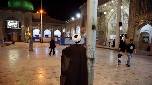 A clergyman stands at the shrine of the Saint Abdulazim during the holy fasting month of Ramadan in Shahr-e-Ray, south of Tehran.