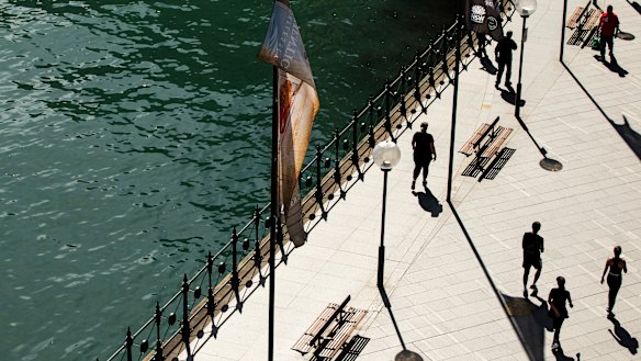 Circular Quay is normally filled with tourists, but social distancing measures are keeping people away. 