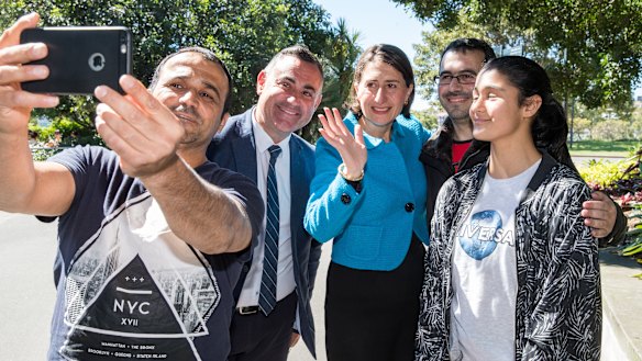 Premier Gladys Berejiklian and Deputy Premier John Barilaro with members of the public on Sunday after announcing the new ministry.