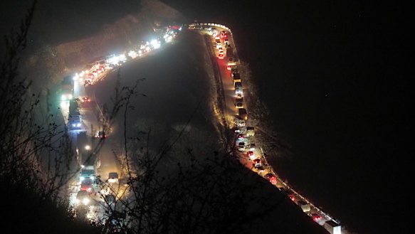 Cars and trucks stuck in a huge traffic jam climbing along the road from Kalbajar to a mountain pass leaving the separatist region of Nagorno-Karabakh to Armenia.