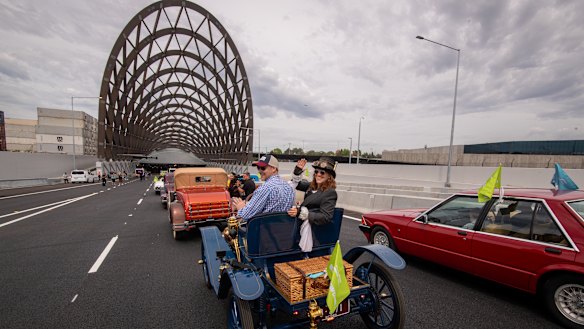 Louise Karch (right) is about to drive through the tunnel in her vintage car.