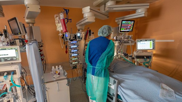 Head physician Lorenz Nowak treats a coronavirus patient in the ICU of the Asklepios Clinic in Munich, Germany, on Thursday.