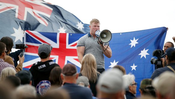 Convicted criminal and right-wing extremist Blair Cottrell addresses the rally.