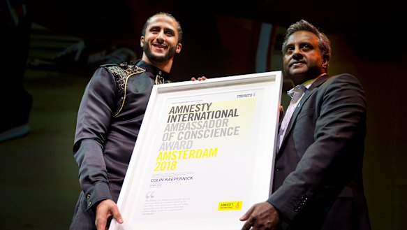 Former NFL quarterback Colin Kaepernick receives the award.