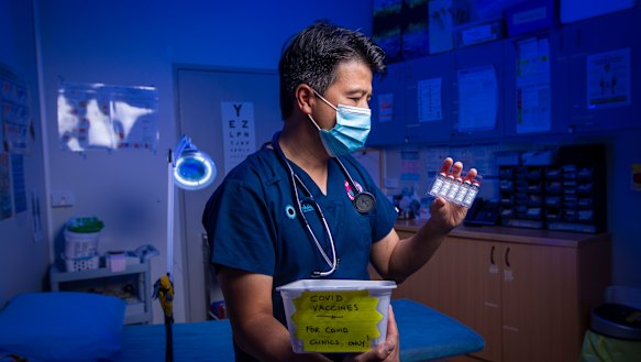 Dr Bernard Shiu prepares to deliver the AstraZeneca COVID-19 vaccine for the first time at the Banksia Medical Centre in Newcomb.