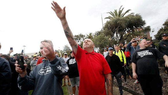 A protester issues a Nazi salute at Saturday's St Kilda rally.