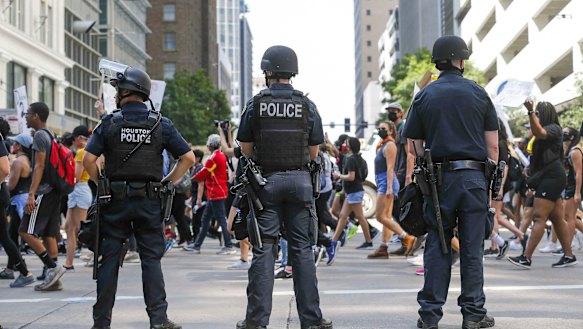 People join George Floyd's family in a march from Discovery Green to City Hall.