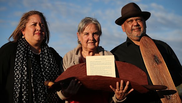 Megan Davis, Pat Anderson and Noel Pearson with a piti holding the Uluru Statement from the Heart.