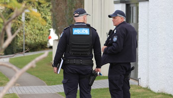 Police near the crime scene in Clayfield the morning after.