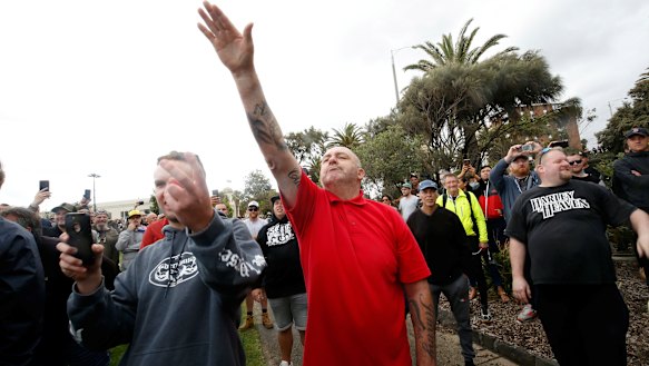 A protester issues a Nazi salute at Saturday's St Kilda rally.