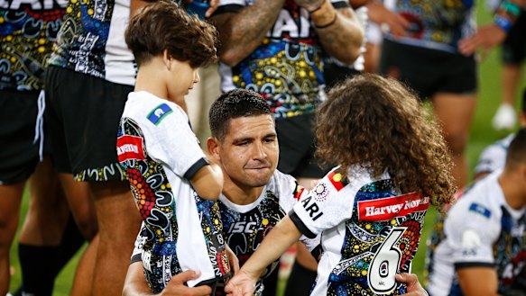 Family matters: Cody Walker with his children after the game.