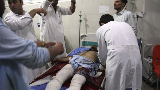 A wounded man receives treatment at a hospital after a suicide car bomb  in Jalalabad, east of Kabul, in August.