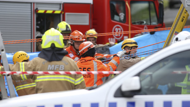 Emergency service workers at the scene of the tragedy.  