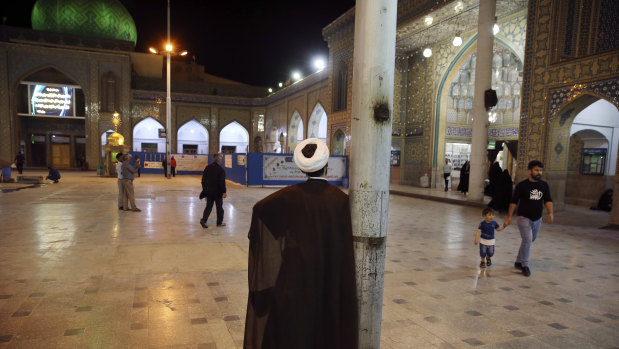 A clergyman stands at the shrine of the Saint Abdulazim during the holy fasting month of Ramadan in Shahr-e-Ray, south of Tehran.