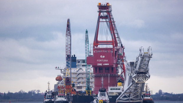 Tugboats get into position in Baltic Sea for the Russian pipe-laying vessel of the German-Russian Nord Stream 2 gas line.