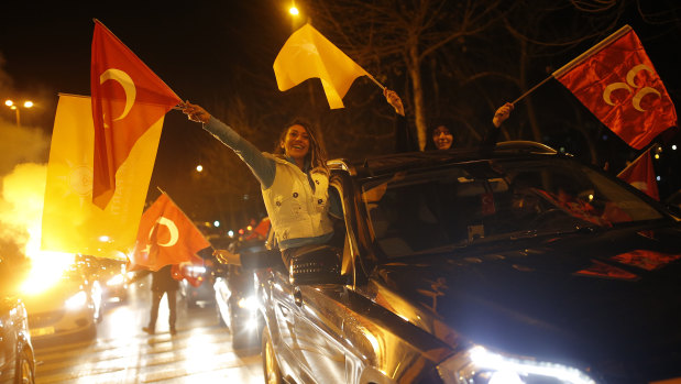 Supporters of President Recep Tayyip Erdogan celebrate in Istanbul, early on Monday, April 1. 