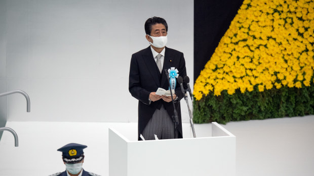 Shinzo Abe, Japan's Prime Minister, wearing a protective mask speaks during a memorial service marking the 75th anniversary of the end of World War II in Tokyo, Japan.