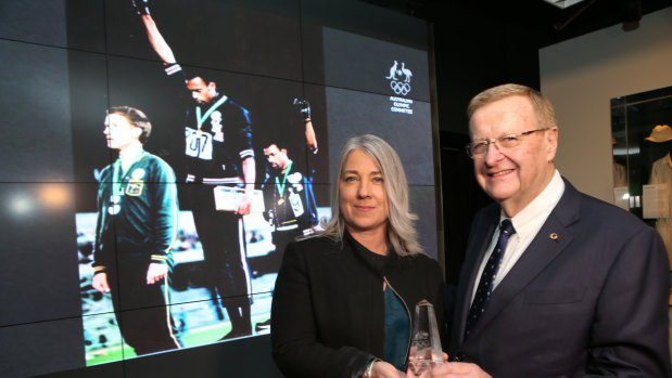 Recognition, at last: Australian Olympic Committee president John Coates and Janita Norman during a ceremony for late Olympian Peter Norman in June.