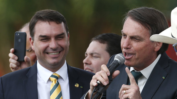 Brazilian Senator Flavio Bolsonaro, left, with his father, President Jair Bolsonaro.