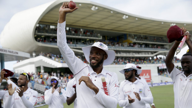 Roston Chase celebrates his eight-wicket haul.